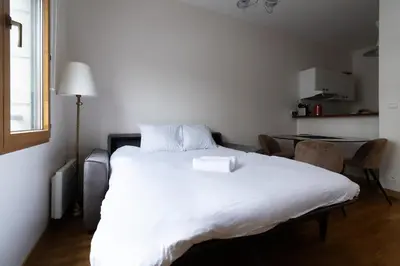 Un ou plusieurs lits dans un hébergement de l'établissement Appartement 2 personnes proche Beaugrenelle - II