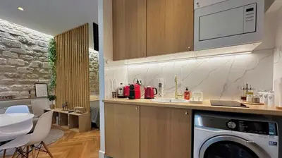 Cuisine ou kitchenette dans l'établissement Studio Amelot, Charming & Pierre