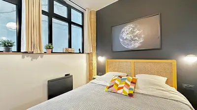Un ou plusieurs lits dans un hébergement de l'établissement Loft moderne Saint-Ambroise