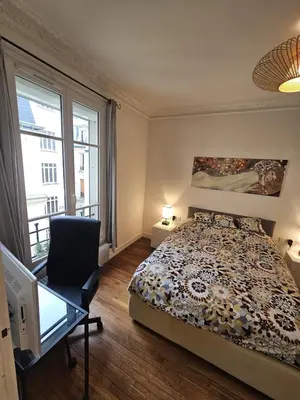 Un ou plusieurs lits dans un hébergement de l'établissement Montmartre beautiful 67 m2 Apartment with Gym & Balcony