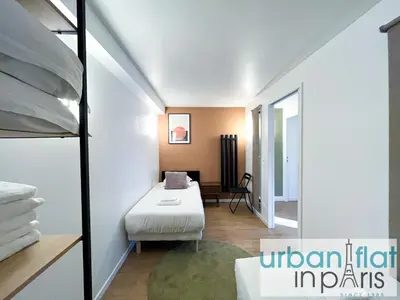Un ou plusieurs lits dans un hébergement de l'établissement Urban Flat 194 - Spacious 3 Bedroom Montmartre