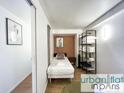 Un ou plusieurs lits dans un hébergement de l'établissement Urban Flat 194 - Spacious 3 Bedroom Montmartre