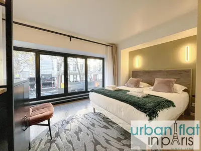 Un ou plusieurs lits dans un hébergement de l'établissement Urban Flat 194 - Spacious 3 Bedroom Montmartre