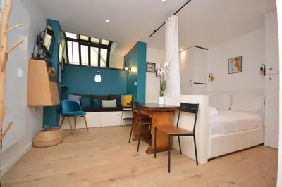 Coin salon dans l'établissement Cosy Studio Bourse Grands Boulevards