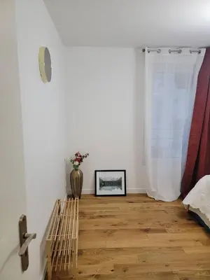 Un ou plusieurs lits dans un hébergement de l'établissement Chambre cosy près de Paris dans un appartement partagé