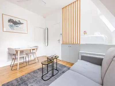 Coin salon dans l'établissement Cosy Studio Etoile Friedland