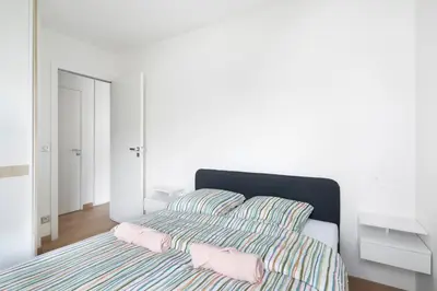 Un ou plusieurs lits dans un hébergement de l'établissement Lumineux 2 chambres avec Terrasse
