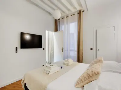 Un ou plusieurs lits dans un hébergement de l'établissement Charming flat at the foot of Les Halles