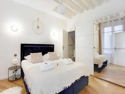 Un ou plusieurs lits dans un hébergement de l'établissement Charming flat at the foot of Les Halles