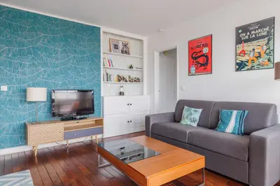 Coin salon dans l'établissement Charming apartment with balcony and view - 1BDR 2P - 19th arr