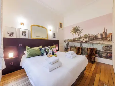 Un ou plusieurs lits dans un hébergement de l'établissement Superb central 2BDR 4P apartment - Palais Royal