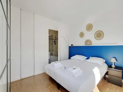 Un ou plusieurs lits dans un hébergement de l'établissement Super flat with balcony 2P 1 BDR - Levallois