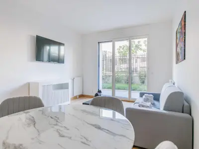 Coin salon dans l'établissement Charming apartment - Levallois-Perret - Mobility Lease
