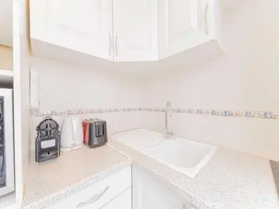 Cuisine ou kitchenette dans l'établissement Cosy studio for two Tour Eiffel Champs de Mars