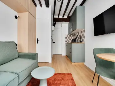 Télévision ou salle de divertissement dans l'établissement Cosy studio - 2P - Passy Tour Eiffel