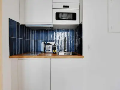 Cuisine ou kitchenette dans l'établissement Pleasant studio - 2P - Passy Tour Eiffel