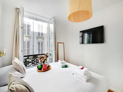 Un ou plusieurs lits dans un hébergement de l'établissement Charming apt- 2BD 4P - Saintonge Le Marais