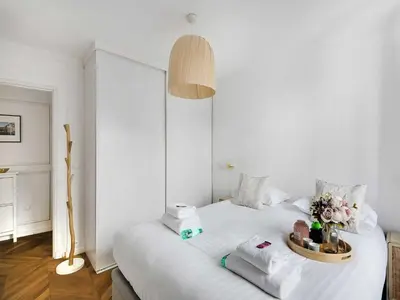 Un ou plusieurs lits dans un hébergement de l'établissement Charming apt- 2BD 4P - Saintonge Le Marais