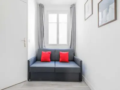 Coin salon dans l'établissement Cosy studio LEVALLOIS - Mobility lease