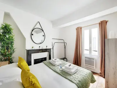 Un ou plusieurs lits dans un hébergement de l'établissement Cosy apartment - 2BD 4P - Canal St-Martin