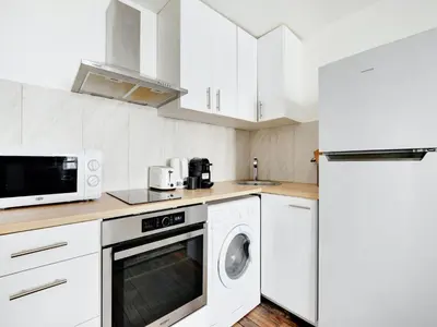 Cuisine ou kitchenette dans l'établissement Cosy apartment - 2BD 4P - Canal St-Martin