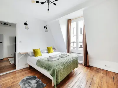 Un ou plusieurs lits dans un hébergement de l'établissement Cosy apartment - 2BD 4P - Canal St-Martin