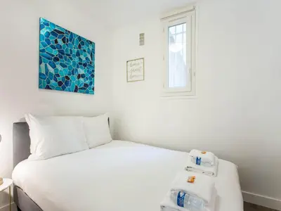 Un ou plusieurs lits dans un hébergement de l'établissement Magnificent apprt -1BR 4P- Montmartre Sacré c ur