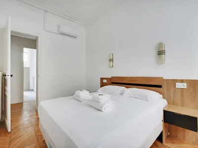 Un ou plusieurs lits dans un hébergement de l'établissement Very elegant apartment 3BDR 6P - Mairie de Neuilly