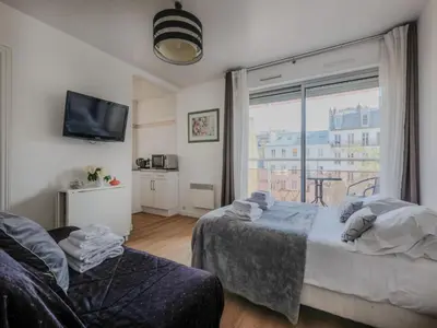 Un ou plusieurs lits dans un hébergement de l'établissement Cosy Studio- 4P - République