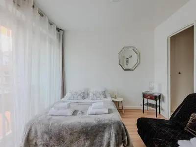 Un ou plusieurs lits dans un hébergement de l'établissement Cosy Studio- 4P - République