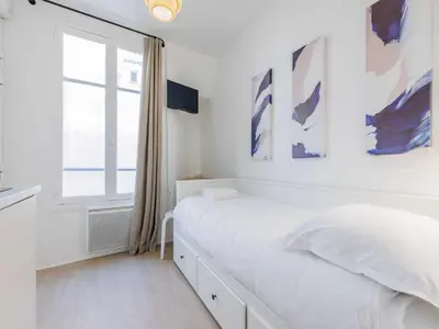 Un ou plusieurs lits dans un hébergement de l'établissement Charming Cosy Studio -1P - Opéra Garnier