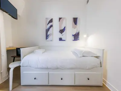 Un ou plusieurs lits dans un hébergement de l'établissement Charming Cosy Studio -1P - Opéra Garnier