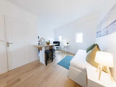 Un ou plusieurs lits dans un hébergement de l'établissement Charming studio - 9eme arrd 2P - Grands Boulevards