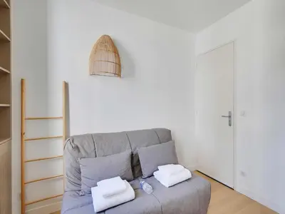 Coin salon dans l'établissement Studio Cosy - 2P - 16th arr - AUTEUIL MOLITOR