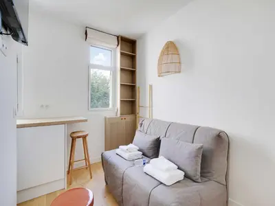 Coin salon dans l'établissement Studio Cosy - 2P - 16th arr - AUTEUIL MOLITOR