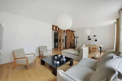 Coin salon dans l'établissement Cosy flat in the heart of Paris - Mobility lease