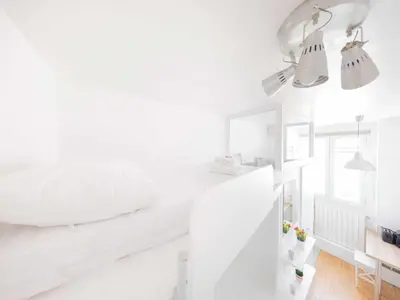 Un ou plusieurs lits dans un hébergement de l'établissement Bright studio - 1P - Arc de Triomphe