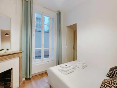 Un ou plusieurs lits dans un hébergement de l'établissement Charming flat - 1BD 3P - Felix Faure