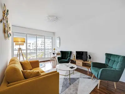 Coin salon dans l'établissement Cosy apartment with balcony -1BDR 2P- La Villette