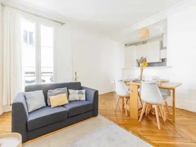 Coin salon dans l'établissement Charming Apartment 1BDR 2P - Grands Boulevards