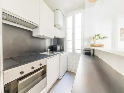 Cuisine ou kitchenette dans l'établissement Charming Apartment 1BDR 2P - Grands Boulevards
