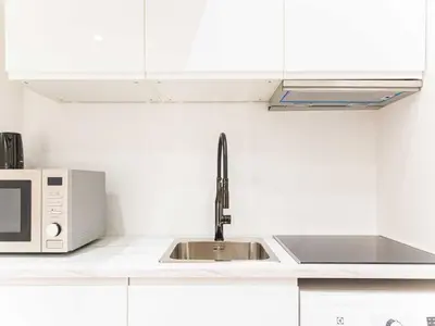 Cuisine ou kitchenette dans l'établissement studio COSY - 2P - REPUBLIQUE