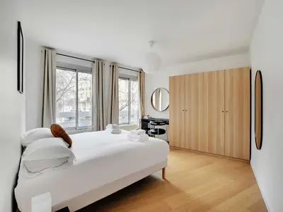 Un ou plusieurs lits dans un hébergement de l'établissement Superb 2 bedroom 4P Alésia