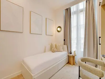 Un ou plusieurs lits dans un hébergement de l'établissement Cozy and Modern Studio - 2P - Palais Royal
