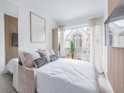 Un ou plusieurs lits dans un hébergement de l'établissement Superb 2P studio near Trocadero