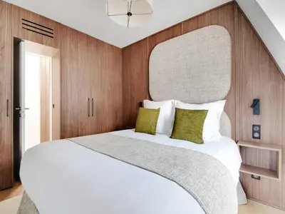 Un ou plusieurs lits dans un hébergement de l'établissement Modern Apt -1BR 4P - View Eiffel Tower Passy