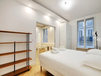Un ou plusieurs lits dans un hébergement de l'établissement Elegant apartment 3BDR 6P - Champs-Élysées