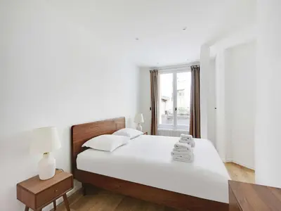 Un ou plusieurs lits dans un hébergement de l'établissement Modern and elegant apt 1BD 4P - Quartier Latin