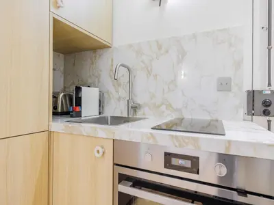 Cuisine ou kitchenette dans l'établissement Modern studio -2P- near Montmartre