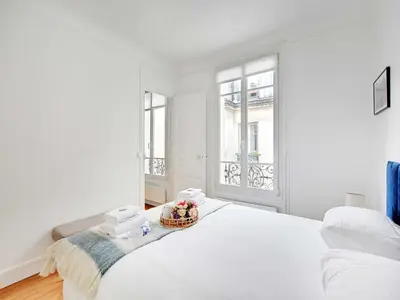 Un ou plusieurs lits dans un hébergement de l'établissement Charming apartment near the Eiffel Tower - Mobility lease